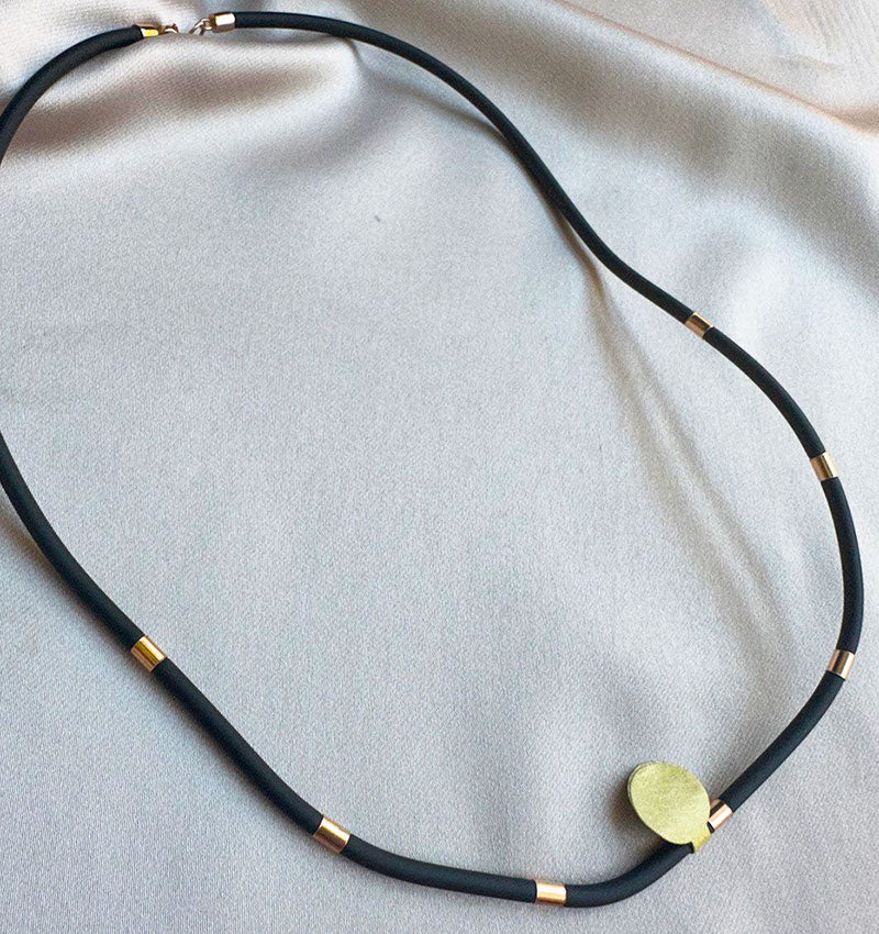 Rose gold necklace with rubber and leather