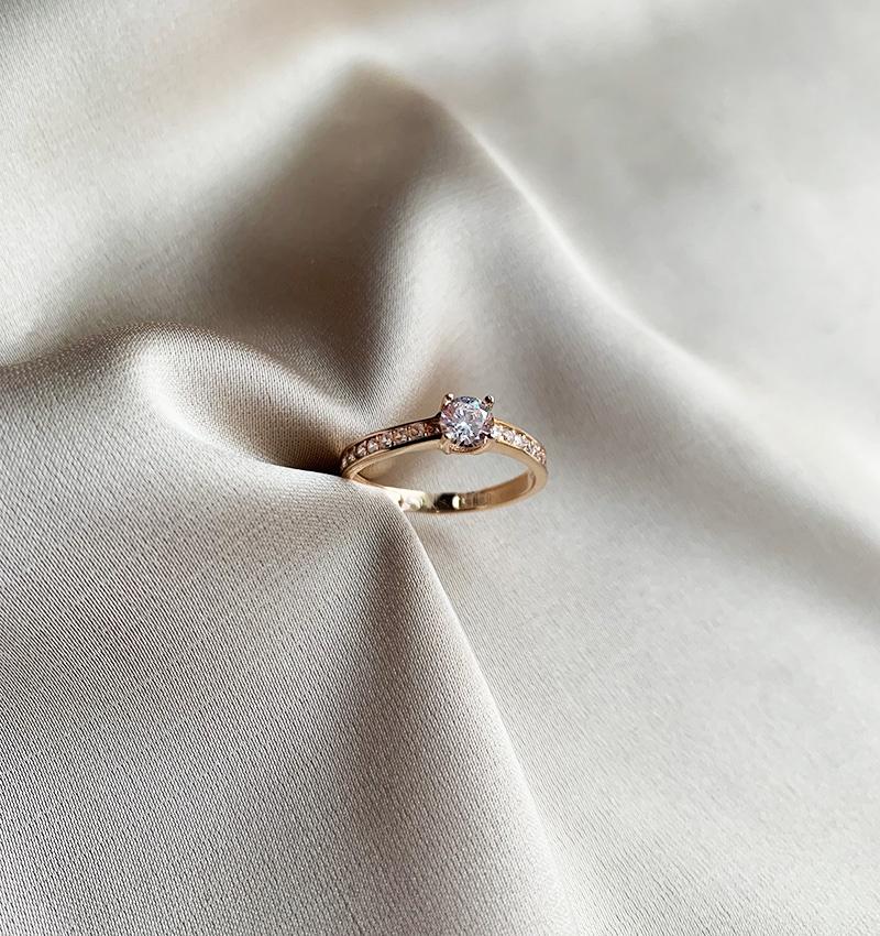 Rose gold engagement ring with a zircon