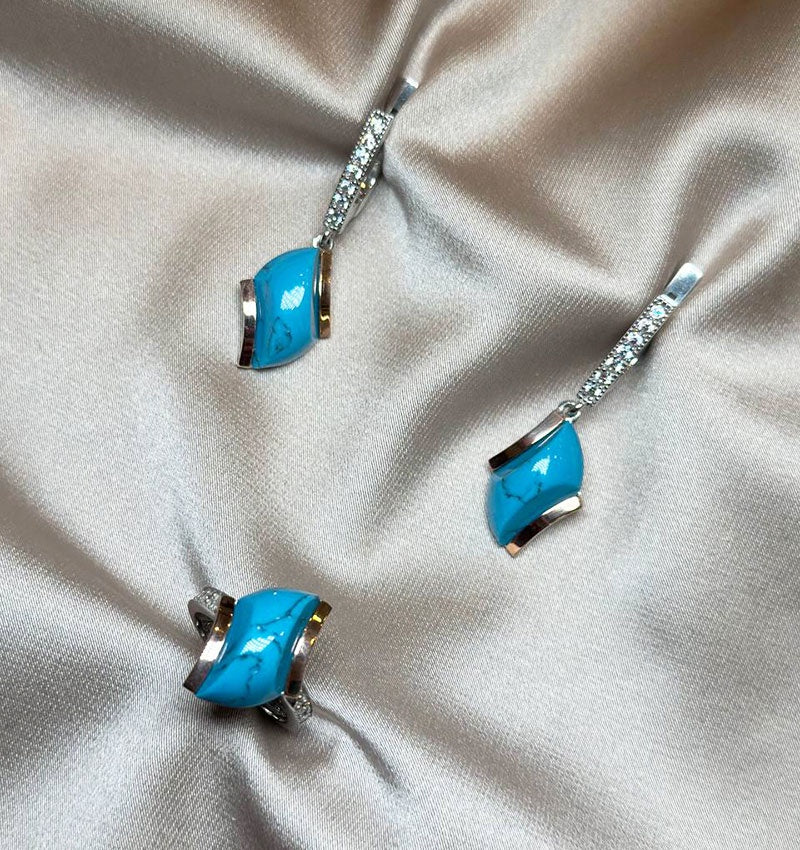 A set of silver with gold inserts, turquoise and zircon