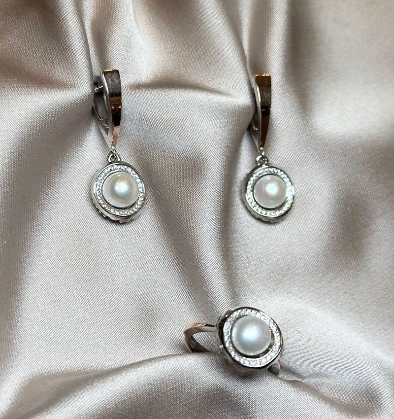 A set of silver with gold inserts, zircons, and pearls
