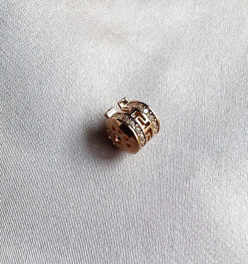Rose gold charm with zircon
