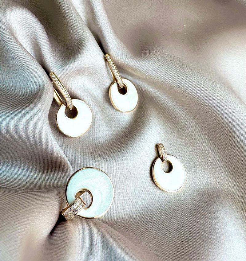 Rose gold set with zircon and mother-of-pearl