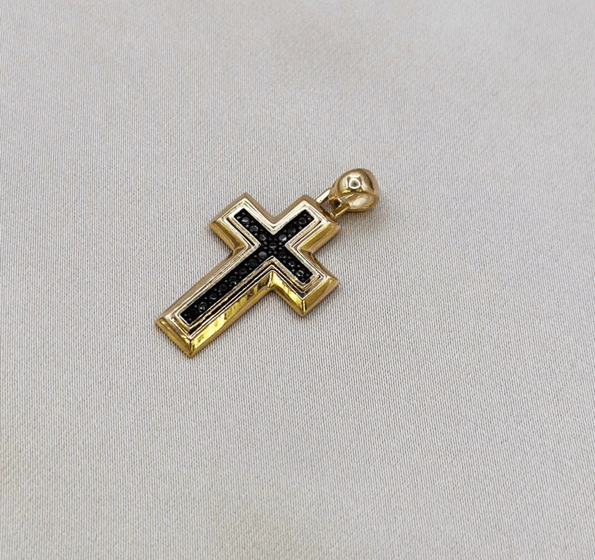 Rose gold cross with a cubic zirconia