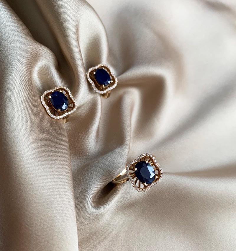 Rose gold set with synthetic sapphire and zircon