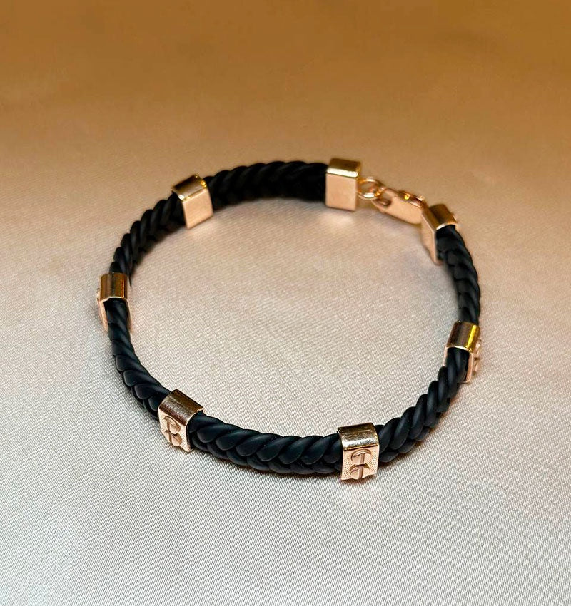 Rose gold, caoutchouc, and leather bracelet