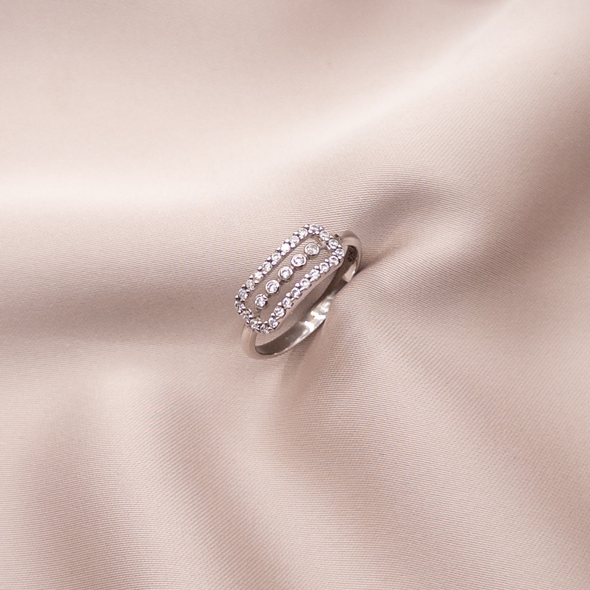 Silver ring with a zircon