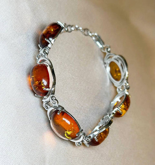 Silver bracelet with gold inserts and amber