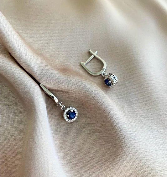 White gold earrings with a diamond and 0.55ct sapphire