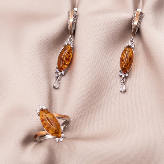 Silver set with gold inserts with zircon and amber