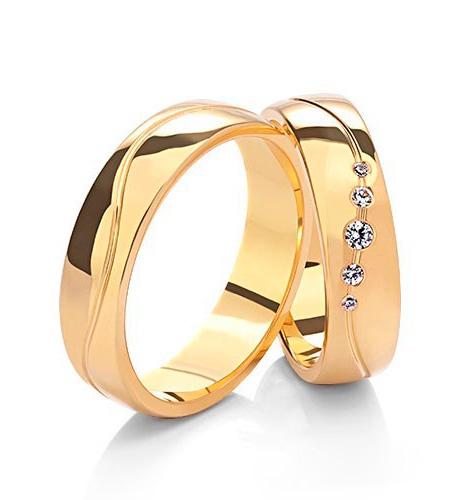 Wedding rings in white, rose, and yellow gold with cubic zirconia
