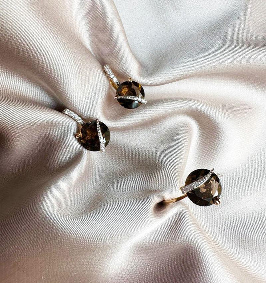 Rose gold set with zircon and smoky topaz