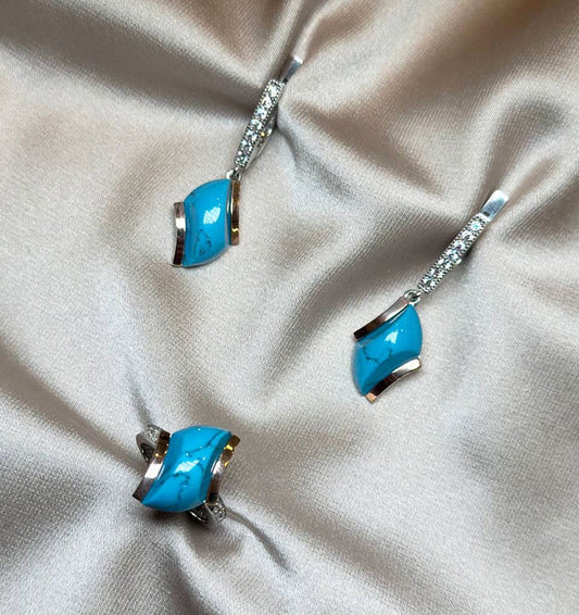 A set of silver with gold inserts, turquoise and zircon
