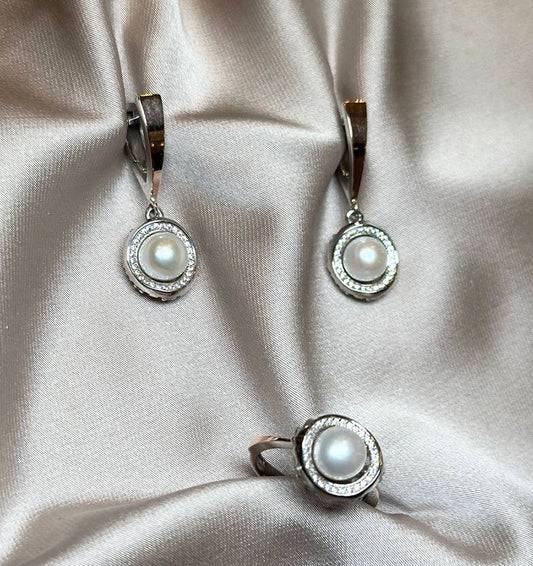 A set of silver with gold inserts, zircons, and pearls