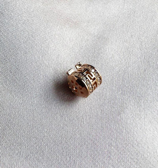 Rose gold charm with zircon