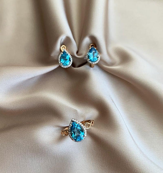 Rose gold set with zircon and topaz