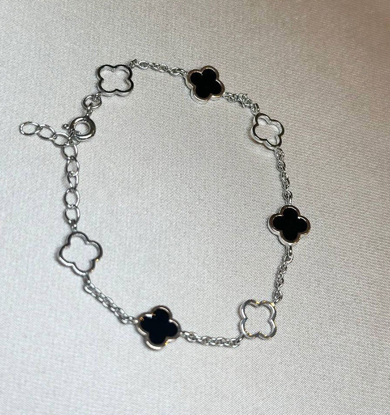 Silver bracelet with gold inserts and onyx