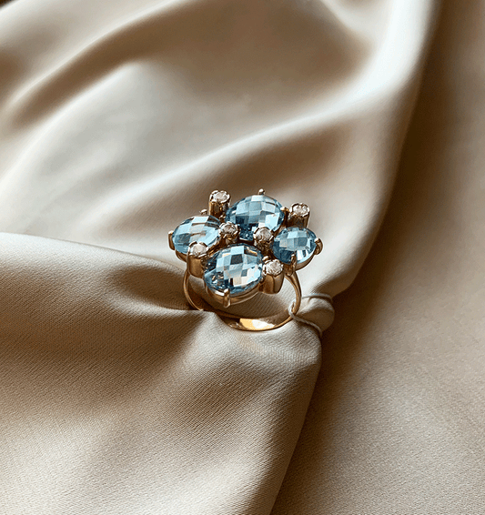 Rose gold ring with zircon and topaz