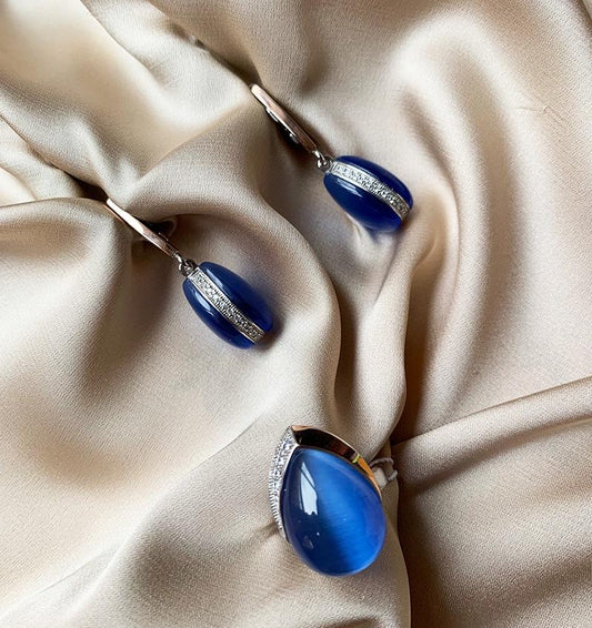 A set of silver with gold inserts featuring ulexite and zircon