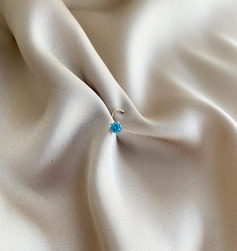 Rose gold piercing with zircon