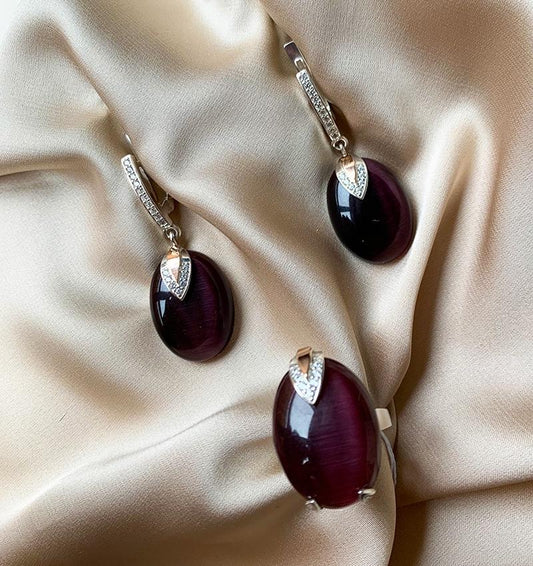 A set of silver with gold inserts featuring ulexite and zircon